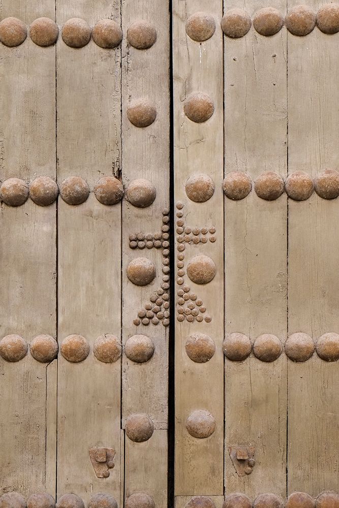 Cordoba-Spain. Ancient wooden door with cross
